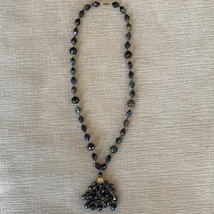 Iridescent Black Necklace with Golden Accents